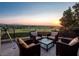 Relaxing balcony with comfortable seating and stunning golf course and sunset views at 28 Painted Feather Way, Las Vegas, NV 89135