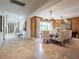 Elegant dining area featuring large windows and an open floor plan at 28 Painted Feather Way, Las Vegas, NV 89135