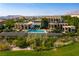 Expansive backyard featuring a modern pool, patio area, and lush greenery, perfect for outdoor living at 28 Painted Feather Way, Las Vegas, NV 89135