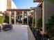 Elegant courtyard with sleek water features and fire bowls leading to the grand entrance at 28 Painted Feather Way, Las Vegas, NV 89135