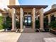 Elegant entrance showcasing serene water features and striking fire bowls at 28 Painted Feather Way, Las Vegas, NV 89135
