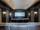 Beautiful home theater room with comfortable seating and large screen for entertainment at 28 Painted Feather Way, Las Vegas, NV 89135