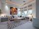 Inviting living room with a large sectional sofa, custom accent lighting, and modern decor for a cozy space at 28 Painted Feather Way, Las Vegas, NV 89135