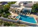 Luxurious backyard with a pristine pool, fountain feature, and stylish outdoor lounge area at 28 Painted Feather Way, Las Vegas, NV 89135