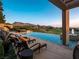Inviting pool with lounge chairs overlooking beautiful mountain and golf course views at 28 Painted Feather Way, Las Vegas, NV 89135