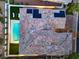 An aerial of a rooftop with solar panels, a tile roof, a pool, and landscaping at 3020 Via Venezia, Henderson, NV 89052