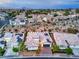 Aerial view of a desert community featuring homes with tile roofs and solar panels at 3020 Via Venezia, Henderson, NV 89052