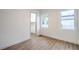 Well-lit bedroom with wood floors, white walls, and a closet at 3020 Via Venezia, Henderson, NV 89052