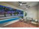 Covered patio area with pool and an outdoor seating area at 3020 Via Venezia, Henderson, NV 89052