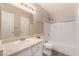 Clean bathroom with a white vanity, mirror, and tub-shower combo at 3151 Soaring Gulls Dr # 2034, Las Vegas, NV 89128