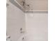Close-up of the white tiled shower-tub combo at 3151 Soaring Gulls Dr # 2034, Las Vegas, NV 89128
