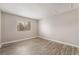 Bright bedroom with hardwood floors and a sunlit window at 3151 Soaring Gulls Dr # 2034, Las Vegas, NV 89128