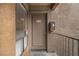 Condo entrance with taupe door, unit number 2034, and exterior fire extinguisher at 3151 Soaring Gulls Dr # 2034, Las Vegas, NV 89128