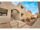 Stairway leads to condo entrance, featuring stucco exterior and low-maintenance landscape at 3151 Soaring Gulls Dr # 2034, Las Vegas, NV 89128