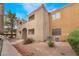 A two-story home features stucco exterior, red tile roof, and low-maintenance landscaping at 3151 Soaring Gulls Dr # 2034, Las Vegas, NV 89128