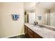 Bathroom with a single sink vanity, granite counters, mirror, and walk-in shower at 3381 Biscayne Bay Dr, Las Vegas, NV 89117