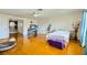 Bright bedroom with hardwood floors, a ceiling fan, and cozy furniture at 3381 Biscayne Bay Dr, Las Vegas, NV 89117