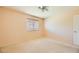 Neutral bedroom featuring carpeted floor, a ceiling fan and natural light at 3381 Biscayne Bay Dr, Las Vegas, NV 89117