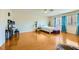 Bright and spacious bedroom with wood floors, modern furniture, and natural light at 3381 Biscayne Bay Dr, Las Vegas, NV 89117