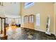 Grand foyer with soaring ceilings, decorative double doors, tile flooring, and an abundance of natural light at 3381 Biscayne Bay Dr, Las Vegas, NV 89117