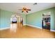 Bright living room with hardwood floors leading to the kitchen at 3381 Biscayne Bay Dr, Las Vegas, NV 89117