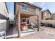 Backyard view with a covered patio area and a partially finished yard at 3553 Judson Ave, Las Vegas, NV 89115