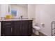 Bathroom featuring granite countertops, dark wood cabinets, and stainless steel fixtures at 3553 Judson Ave, Las Vegas, NV 89115