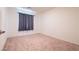 Bedroom featuring carpet flooring, neutral walls, and natural lighting at 3553 Judson Ave, Las Vegas, NV 89115