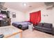 Bedroom with carpet flooring, space for seating, and desk with shelving at 3553 Judson Ave, Las Vegas, NV 89115