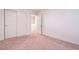 Bright bedroom with sliding door closet, neutral carpet, and open doorway at 3553 Judson Ave, Las Vegas, NV 89115