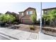 Charming two-story home featuring a two-car garage, well-kept landscaping, and a welcoming brick-paved driveway at 3553 Judson Ave, Las Vegas, NV 89115
