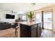 Stylish kitchen with large island, modern appliances, and seamless flow to the living area at 3553 Judson Ave, Las Vegas, NV 89115