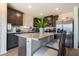 Beautiful kitchen island and stainless steel refrigerator create an open and stylish space at 3553 Judson Ave, Las Vegas, NV 89115