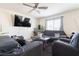 Inviting living room featuring neutral walls, plush carpeting, and a ceiling fan at 3553 Judson Ave, Las Vegas, NV 89115