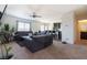 Inviting living room featuring neutral walls, plush carpeting, and an open layout to the kitchen at 3553 Judson Ave, Las Vegas, NV 89115