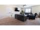 Inviting living room featuring neutral walls, plush carpeting, and a ceiling fan at 3553 Judson Ave, Las Vegas, NV 89115