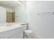 Well-lit bathroom offers a vanity with sink, backsplash, and a mirror and towel rack at 3606 Altar Rock Ln, North Las Vegas, NV 89032