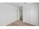 A bedroom with neutral colored carpet and wall paint is equipped with two closets at 3606 Altar Rock Ln, North Las Vegas, NV 89032