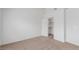 A bright bedroom features neutral carpet and an open closet with shelving for storage at 3606 Altar Rock Ln, North Las Vegas, NV 89032