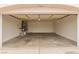 Spacious two-car garage with an open door featuring painted drywall at 3606 Altar Rock Ln, North Las Vegas, NV 89032