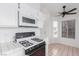 Modern kitchen with microwave and tiled countertop at 3606 Altar Rock Ln, North Las Vegas, NV 89032
