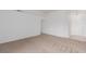 A bright, carpeted living room with white walls and a tiled entry at 3606 Altar Rock Ln, North Las Vegas, NV 89032