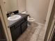 Powder room featuring a black granite countertop and black vanity at 3621 Laguna Verde Way, Las Vegas, NV 89121