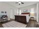 Nicely staged bedroom featuring hard wood floors, desk and good lighting at 4169 San Capri Way, Las Vegas, NV 89141