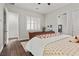 Bright bedroom featuring hard wood floors, white shutters and a white ceiling fan at 4169 San Capri Way, Las Vegas, NV 89141