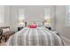 Comfortable bedroom featuring modern decor and two windows with white shutters at 4169 San Capri Way, Las Vegas, NV 89141