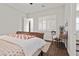 Bright bedroom featuring hard wood floors, white shutters and a white ceiling fan at 4169 San Capri Way, Las Vegas, NV 89141
