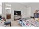 Cozy bedroom with modern decorations, carpet floors and a view to the bathroom at 4169 San Capri Way, Las Vegas, NV 89141