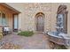 Inviting entryway with a decorative water fountain and stone-paved pathway at 4169 San Capri Way, Las Vegas, NV 89141