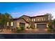 Charming two-story home with a stone-accented facade, two-car garage, and well-maintained landscaping at 4169 San Capri Way, Las Vegas, NV 89141